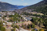 Nestled in a picturesque valley, this property offers stunning views of the surrounding mountains and a serene lake.
