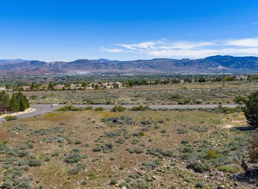 Discover the breathtaking beauty of this expansive property, offering stunning panoramic views of the surrounding mountains and valley.