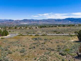 Discover the breathtaking beauty of this expansive property, offering stunning panoramic views of the surrounding mountains and valley.