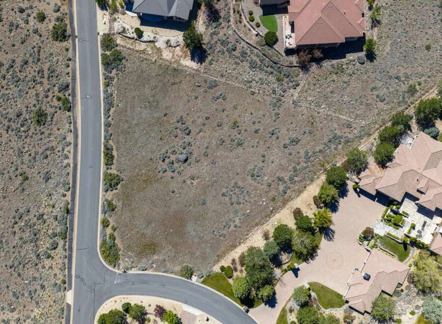 Discover the perfect canvas for your dream home on this expansive vacant lot.