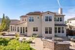 Discover luxury living in this stunning property! This home boasts a beautiful exterior with a tile roof and multiple windows, perfect for natural light.