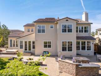 Discover luxury living in this stunning property! This home boasts a beautiful exterior with a tile roof and multiple windows, perfect for natural light.