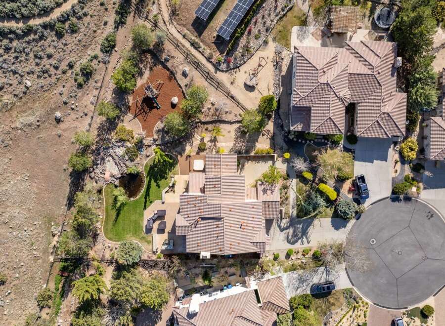Discover luxury living in this stunning property, boasting a beautifully landscaped yard and a private playground.