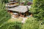 Discover a stunning chalet nestled in a serene natural setting, perfect for a luxurious getaway.