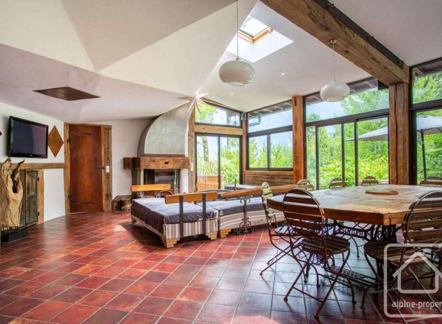 Discover the charm of this stunning property, featuring a spacious living area with a cozy fireplace and a unique design.