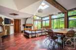 Discover the charm of this stunning property, featuring a spacious living area with a cozy fireplace and a unique design.