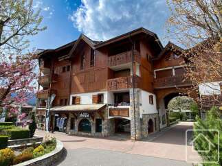 Discover this stunning property featuring a charming wooden facade and a welcoming entrance.