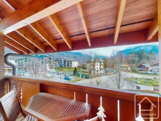 Enjoy breathtaking mountain views from this charming balcony.