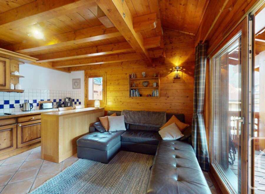 Discover the charm of this cozy property, featuring a beautifully designed interior with wooden accents throughout.