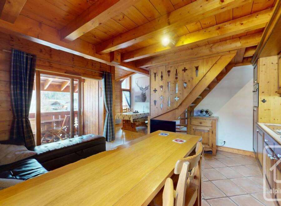 Discover the charm of this stunning property, featuring a warm and inviting interior with exposed wooden beams and a cozy atmosphere.