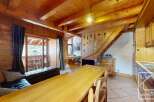 Discover the charm of this stunning property, featuring a warm and inviting interior with exposed wooden beams and a cozy atmosphere.