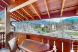 Enjoy breathtaking mountain views from this charming balcony.
