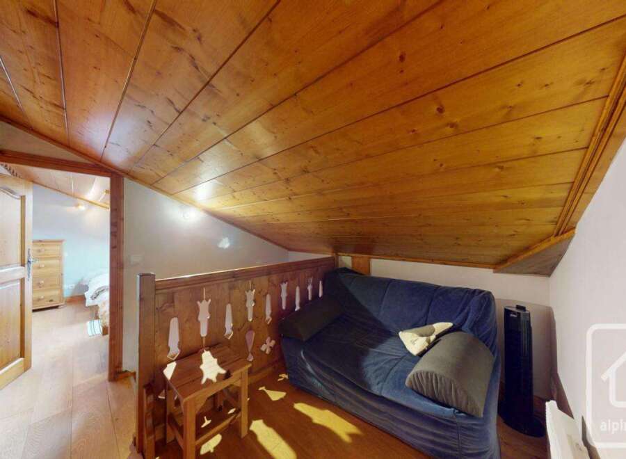 Discover the charm of this cozy property, featuring a beautifully designed interior with wooden accents.