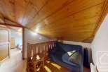 Discover the charm of this cozy property, featuring a beautifully designed interior with wooden accents.