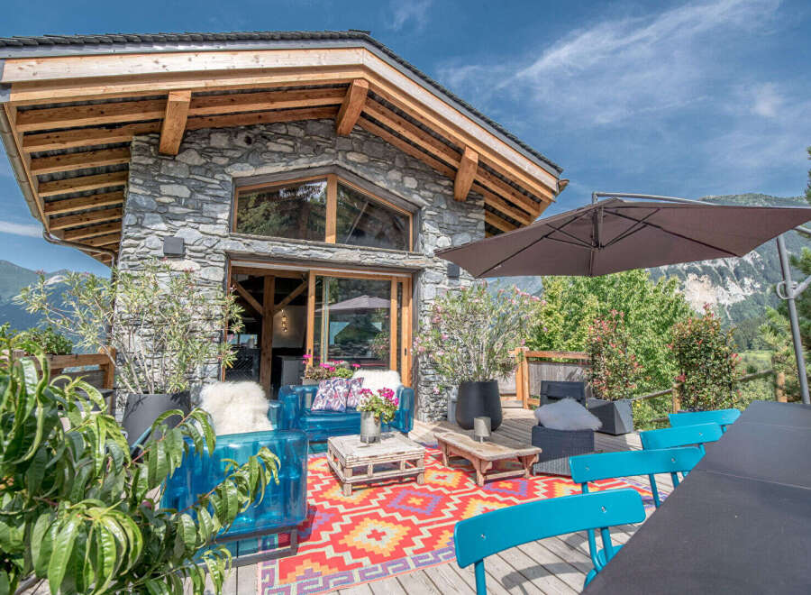 Discover the charm of this stunning property, featuring a beautiful stone exterior and a spacious outdoor deck.