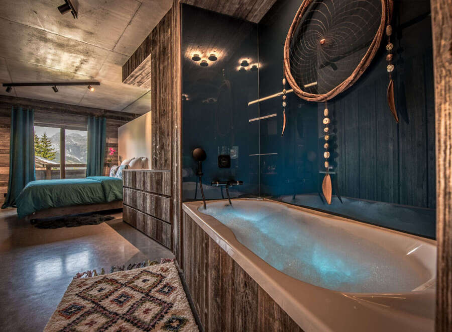 Experience luxury and tranquility in this stunning bedroom with a spa-like bathroom.