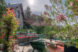 Escape to your own private oasis with this stunning property! Enjoy outdoor dining and relaxation on the spacious deck, complete with a stylish umbrella and comfortable seating.