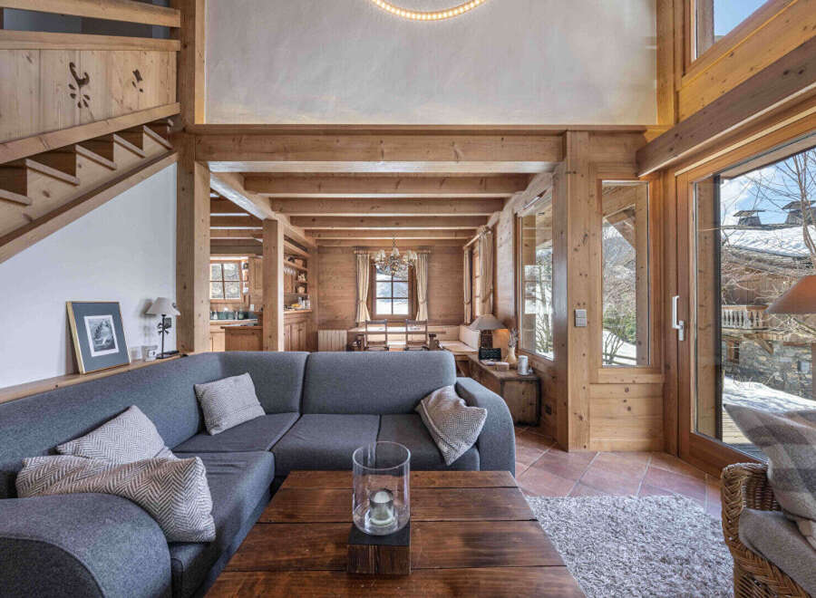 Experience the warmth of this stunning chalet, featuring exposed wooden beams and a cozy ambiance.