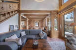 Experience the warmth of this stunning chalet, featuring exposed wooden beams and a cozy ambiance.