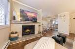 This stunning property boasts a cozy living room with a fireplace, perfect for relaxing evenings.