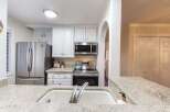 This stunning kitchen boasts modern appliances and ample counter space, perfect for culinary enthusiasts.