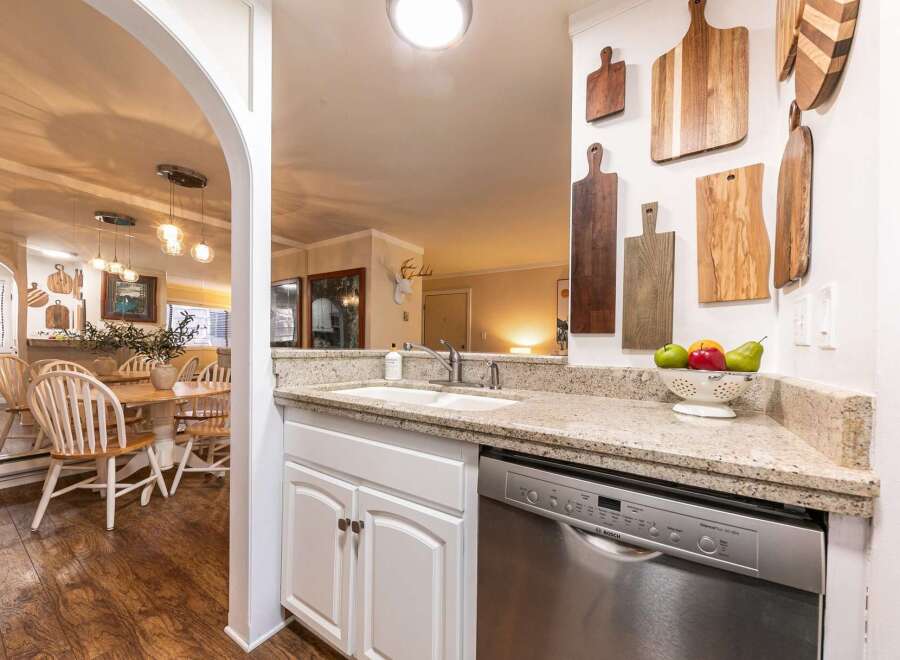 This stunning kitchen boasts a modern design with granite countertops and stainless steel appliances.