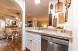 This stunning kitchen boasts a modern design with granite countertops and stainless steel appliances.