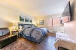 This stunning bedroom boasts a cozy and inviting atmosphere, perfect for relaxation.