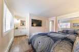 Step into this inviting bedroom, featuring a modern design and ample natural light.