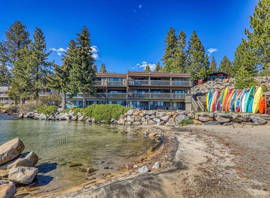 Discover lakeside living at its finest! This stunning property boasts direct beach access, perfect for water activities.