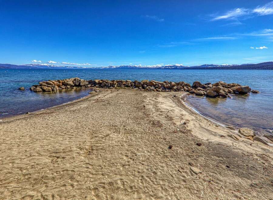 Discover the tranquility of this stunning waterfront property, offering breathtaking views of the lake and surrounding mountains.