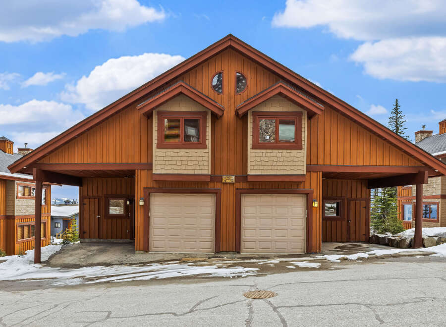 This stunning property features a charming exterior with a unique architectural design.