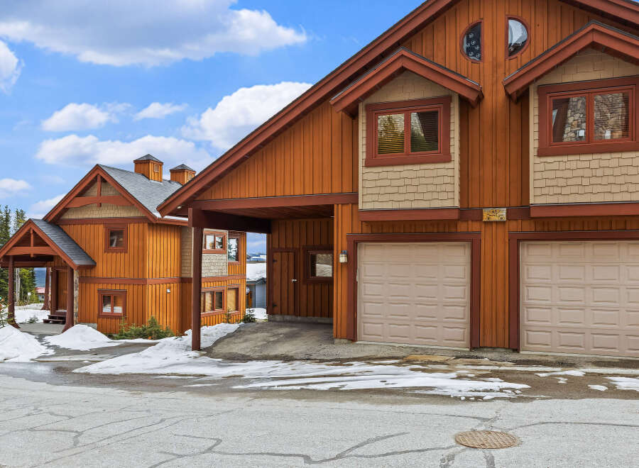 This stunning property boasts a beautiful exterior with a warm, inviting aesthetic.