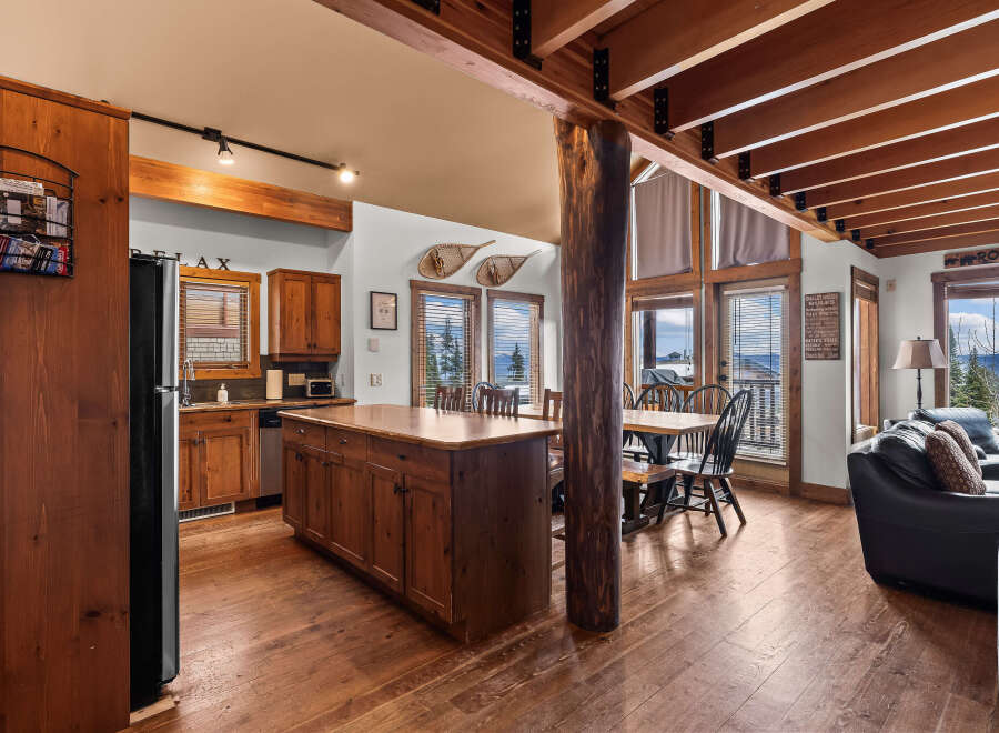 This stunning property boasts a rustic charm with its wooden beams, hardwood floors, and a cozy fireplace.