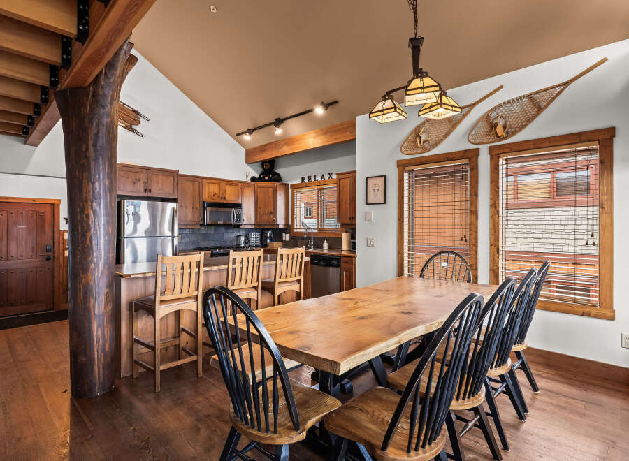 This stunning kitchen and dining area boasts rustic charm and modern amenities.