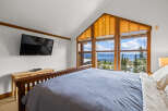 Experience breathtaking mountain views from this stunning bedroom.