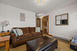 This cozy living room offers a comfortable space for relaxation and entertainment.