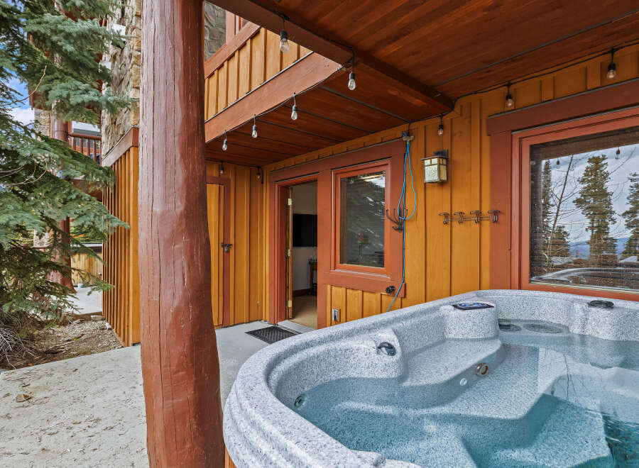 Relax and unwind in this stunning property featuring a luxurious hot tub, perfect for enjoying the beautiful surroundings.