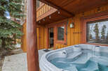 Relax and unwind in this stunning property featuring a luxurious hot tub, perfect for enjoying the beautiful surroundings.