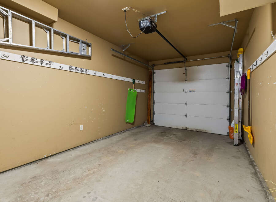 This spacious garage offers ample storage and parking space.