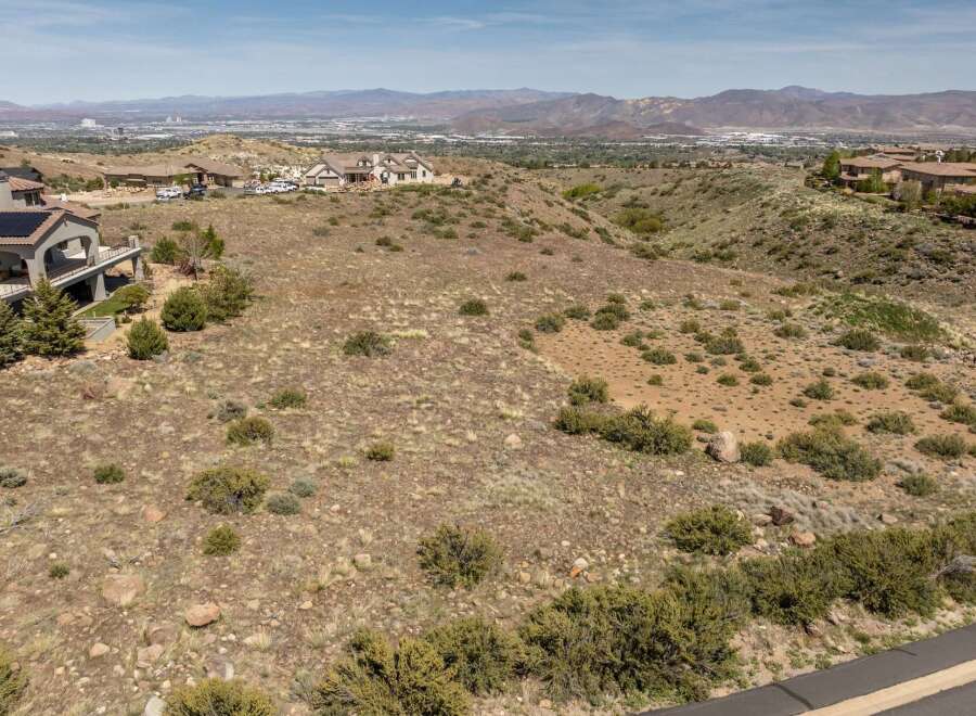 Discover the perfect canvas for your dream home on this stunning hillside property.