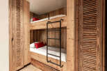 This cozy bunk bed setup is perfect for a vacation home or a kid's room.