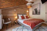 Experience rustic charm and modern comfort in this beautifully appointed bedroom.