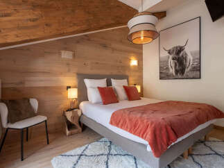 Experience rustic charm and modern comfort in this beautifully appointed bedroom.
