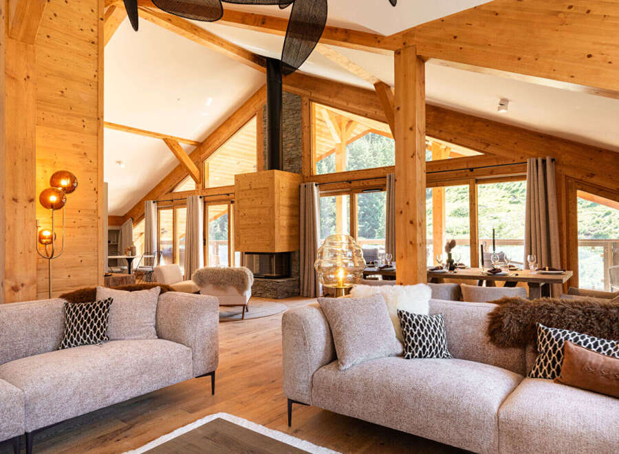 Experience luxury living in this stunning property featuring a cozy fireplace and expansive windows that frame breathtaking views.