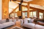 Experience luxury living in this stunning property featuring a cozy fireplace and expansive windows that frame breathtaking views.