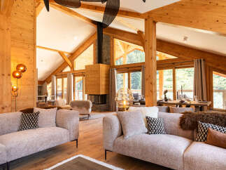 Experience luxury living in this stunning property featuring a cozy fireplace and expansive windows that frame breathtaking views.