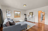 Step into this inviting living space, featuring a cozy fireplace and a stylish entertainment center.