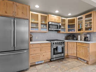 This stunning kitchen boasts a modern design with stainless steel appliances and custom cabinetry.