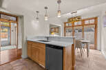 This stunning kitchen boasts a modern design with sleek countertops and ample cabinet space.